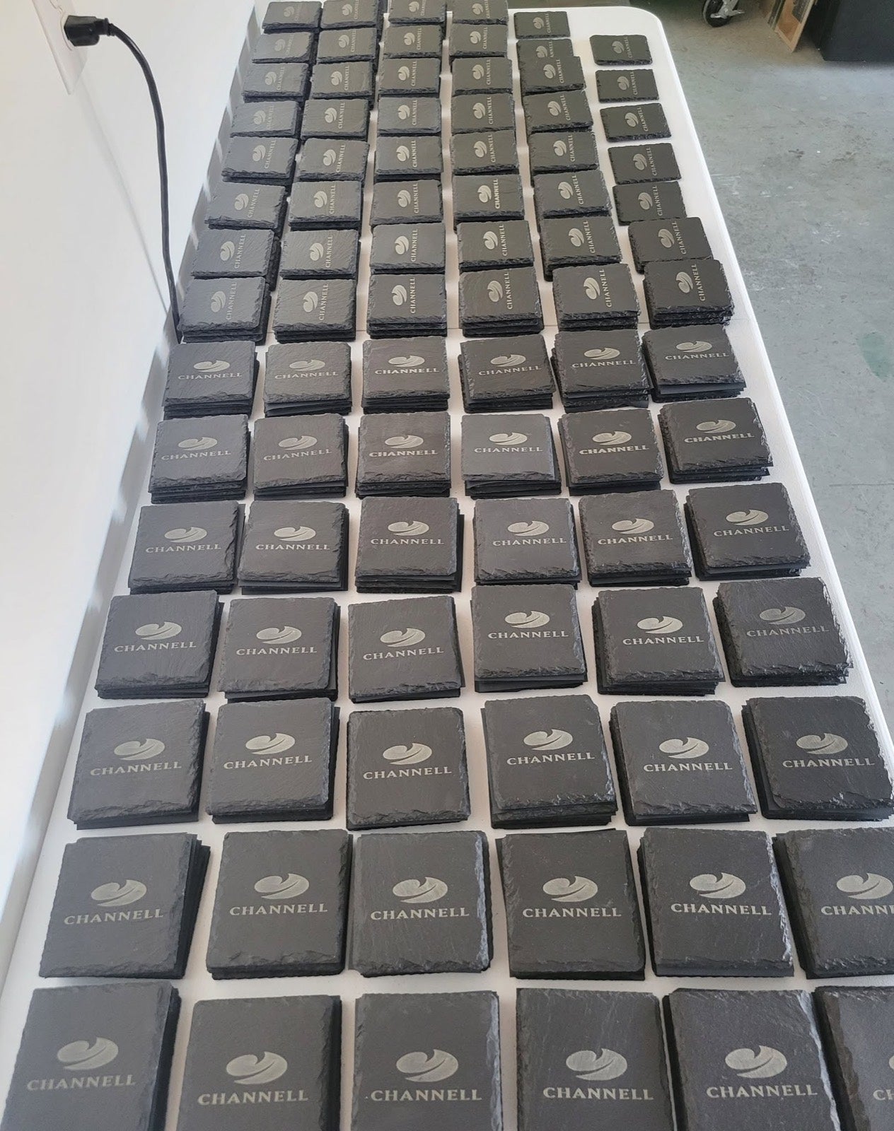 Engraved slate coasters production run