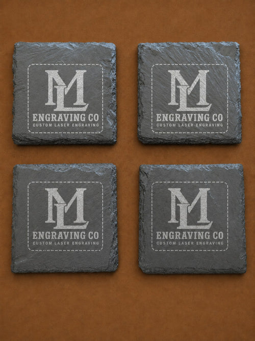 Set of four natural slate coasters laser engraved with the ML Engraving Co logo