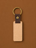 Leather strap keychain with a wood tag blank and antique brass ring