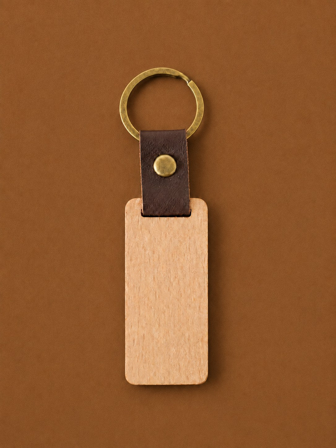 Leather strap keychain with a wood tag blank and antique brass ring