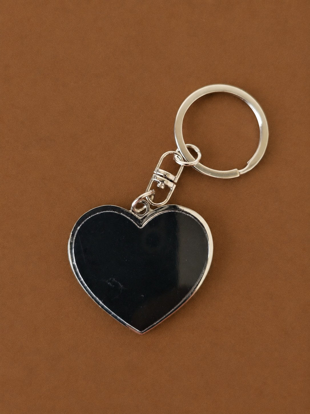 Polished metal heart keychain with a swivel clip