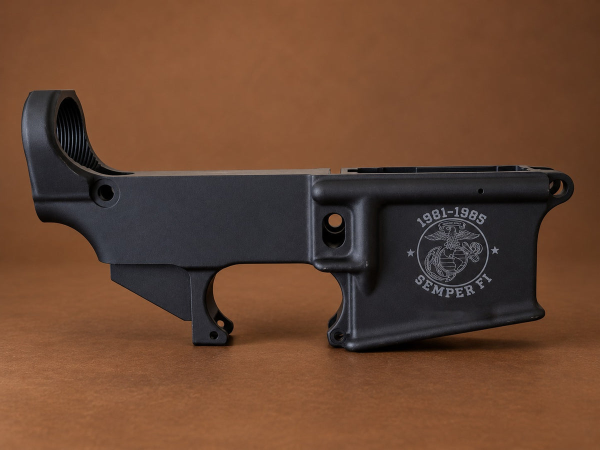 Black AR-15 lower receiver laser engraved with a Marine Corps emblem, 1981-1985 service years and Semper Fi