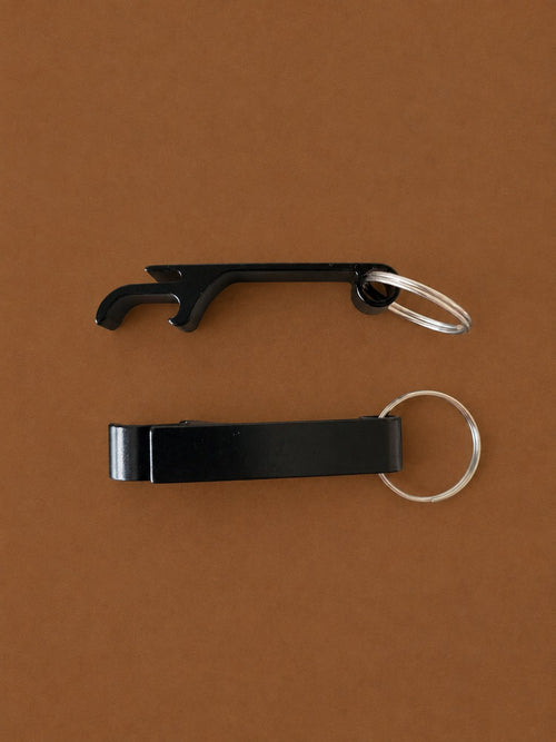 Two black aluminium bottle opener keyrings, front and side