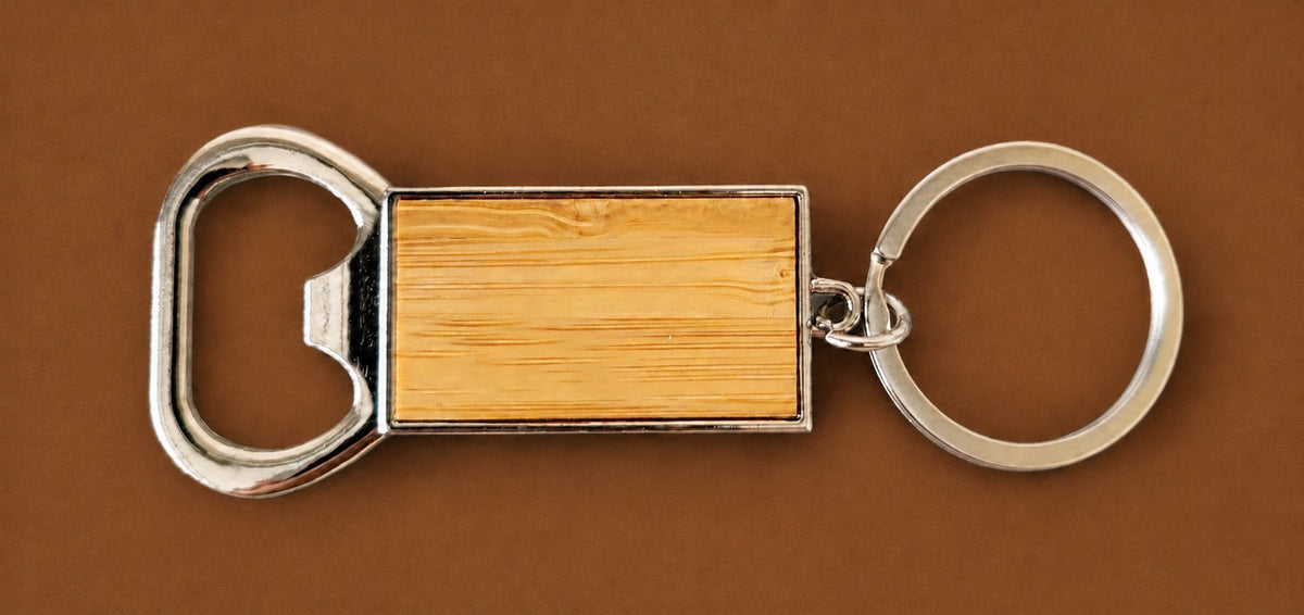 Chrome bottle opener keyring with a wood insert panel for engraving